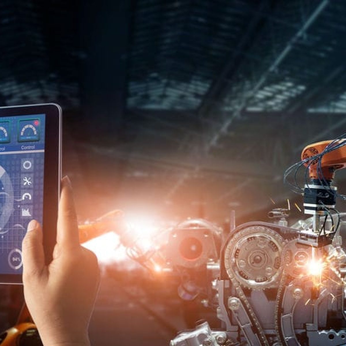 Engineer check and control welding robotics automatic arms machine in intelligent factory automotive industrial with monitoring system software. Digital manufacturing operation. Industry 4.0